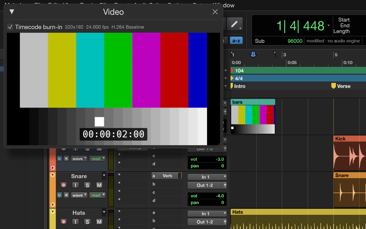 The Video window showing a colour-bar test movie with a timecode burn-in, beside a Video track with thumbnails in the Edit window